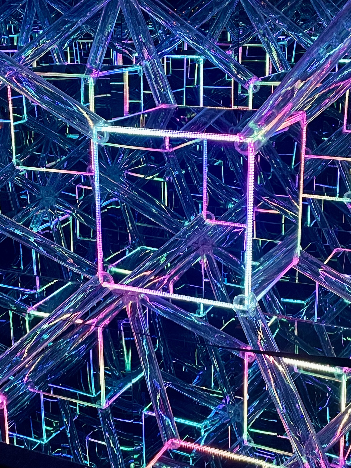A light display utilizing mirrors and colors to capture an infinite number of squares and polygons nesting within each other.